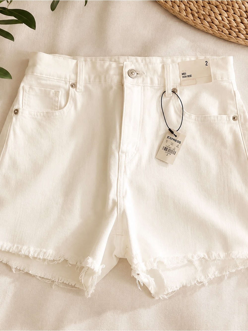 Express jean shorts in white. Midi high rise in size 2